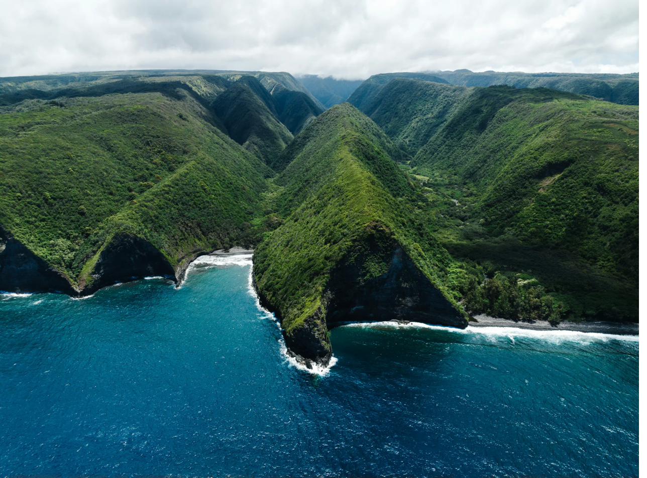 Hawaiian coastline with green mountains